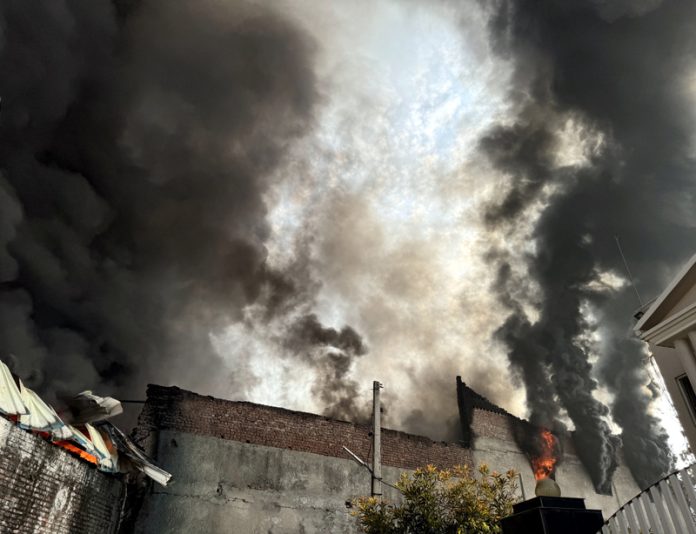 Massive flames emanating out of a mattress factory that caught fire in Gangyal area on Saturday. -Excelsior/Rakesh Massive flames emanating out of a mattress factory that caught fire in Gangyal area on Saturday. -Excelsior/Rakesh