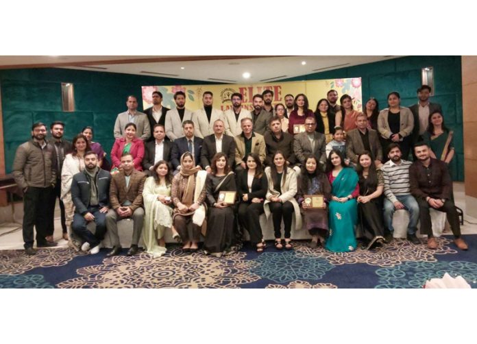 Special guests along with outstanding achievers of Elite Law Institute posing for a group photograph during a function at Jammu on Sunday.