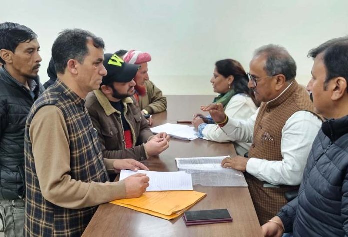 Former Dy CM, Dr Nirmal Singh listening public grievances along with other BJP leaders including Anuradha Charak and Arvind Gupta on Monday.