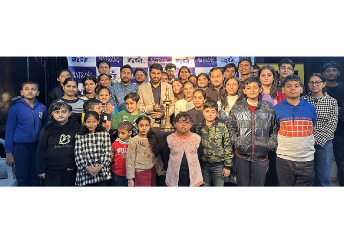 Children posing for a group photograph with Natrang founder Director, Padmashree Balwant Thakur and others at the inauguration of a Theatre Workshop in Jammu on Monday.