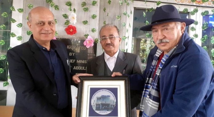 Kunil Bhalla (Managing Trustee, BNGH) presenting a memento to Principal GMC Jammu Dr Ashutosh Gupta during foundation day function of the Hospital.