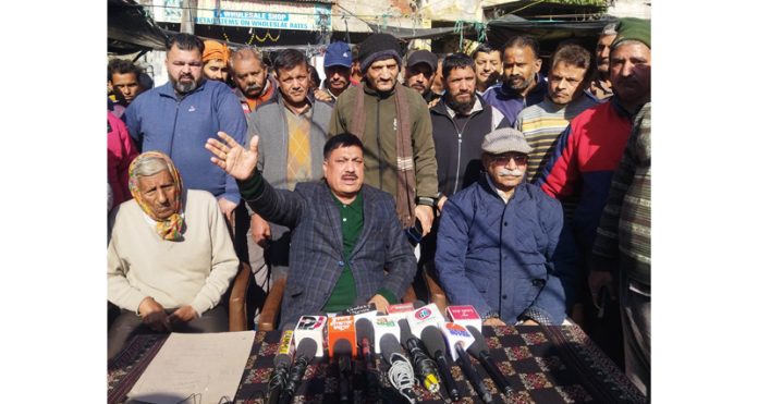 President Parade Mandi Association, Subash Chander Sharma addresses a press conference at Jammu on Tuesday.