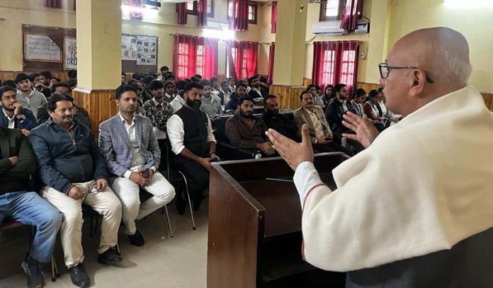 Former Mayor Jammu, Rajinder Sharma addressing the students of Commerce College on Friday.