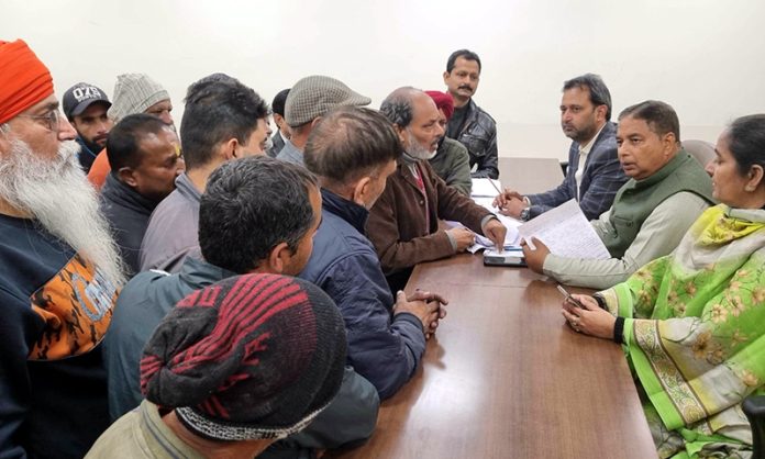 Senior BJP leader and former Minister, Sat Sharma listening public grievances at party Headquarters Jammu on Wednesday.