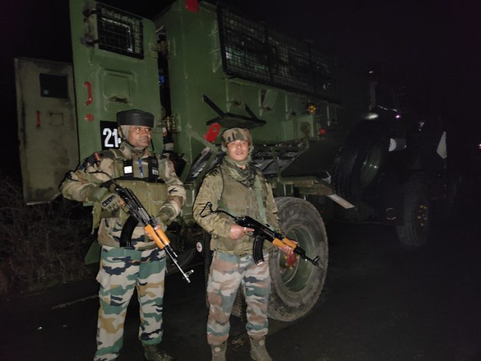 Security forces near the encounter site at Arihal in Pulwama. — Excelsior/Younis Khaliq