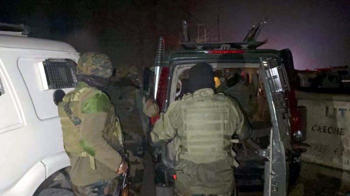 Security forces at the spot in Bemina area of Srinagar where a cop was shot at on Saturday evening. —Excelsior/Shakeel