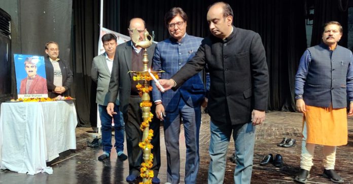 Dignitaries lighting the traditional lamp during Chetna Diwas at Abhinav Theatre on Wednesday. -Excelsior/Rakesh