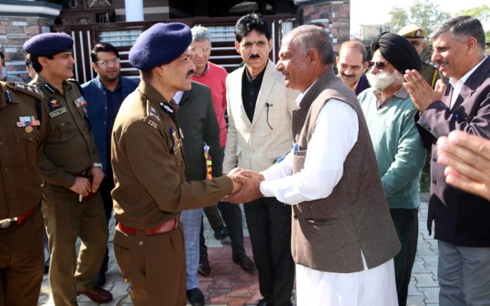 DGP R R Swain meeting family members of martyr Bodh Raj in Samba on Sunday.