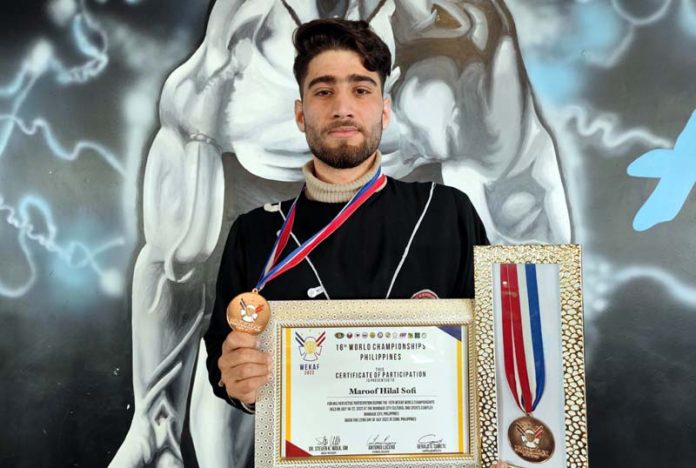 Maroof holding Bronze medal he won for India in Philippines. -Excelsior/Younis Khaliq