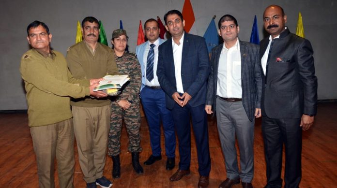 During Alumni meet at Sainik School Nagrota, batch presenting cash prize to general employees.