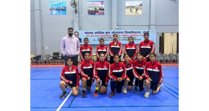 University of Jammu Basketball (Women) team posing with coach Hritik Khullar.
