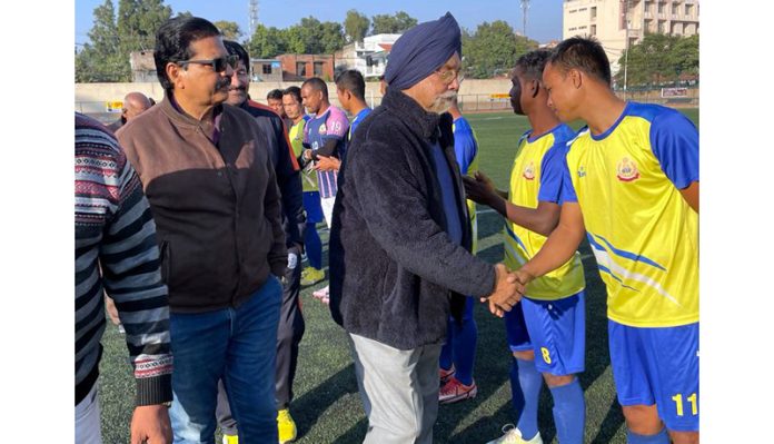 Chief Guest interacting with young football players.