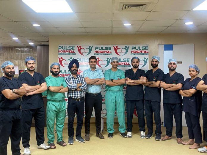 Management of Pulse Hospital and doctors posing together for a group photograph.