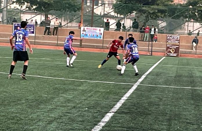 Football players in action during a match in Jammu on Monday.