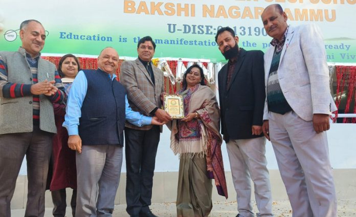 Principal, Government Higher Secondary School Bakshi Nagar Dr Ranjana Sharma presenting memento to chief guest during Annual Day.