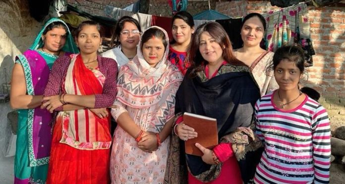 Chief spokesperson of J&K BJP Mahila Morcha Ritika Trehan posing with women during a programme at Channi Himmat, Jammu.