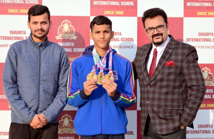 Students of Shaurya International School posing with Principal Dr Rajesh Gandral.
