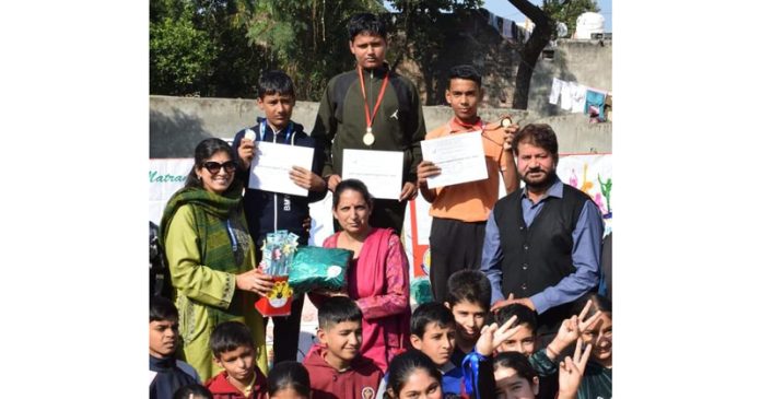 Chief guest presenting certificates and medals to winners during Annual Sports Meet.
