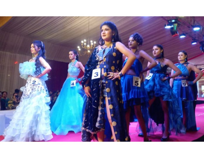 Models during a ramp walk in Jammu on Saturday.