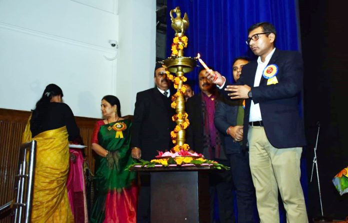 Commissioner Jammu Municipal Corporation, Rahul Yadav lighting lamp during Annual Day event of Cambridge International School.