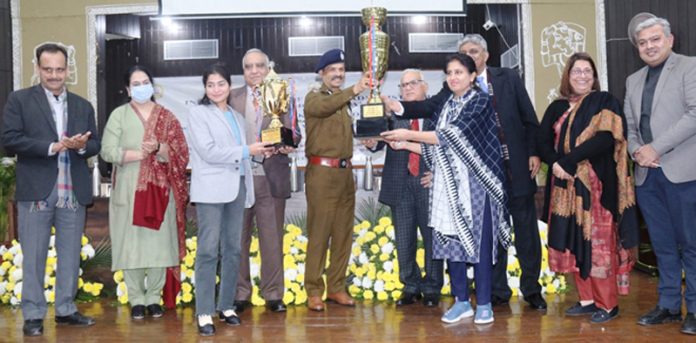 Director General of Police R R Swain presenting trophy to the winning team on Thursday.