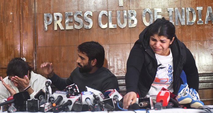 Wrestler's Bajrang Punia, Sakshi Malik and Vinesh Phogat breaks down at a press conference in New Delhi on Thursday.(UNI) Wrestler's Bajrang Punia, Sakshi Malik and Vinesh Phogat breaks down at a press conference in New Delhi on Thursday.(UNI)