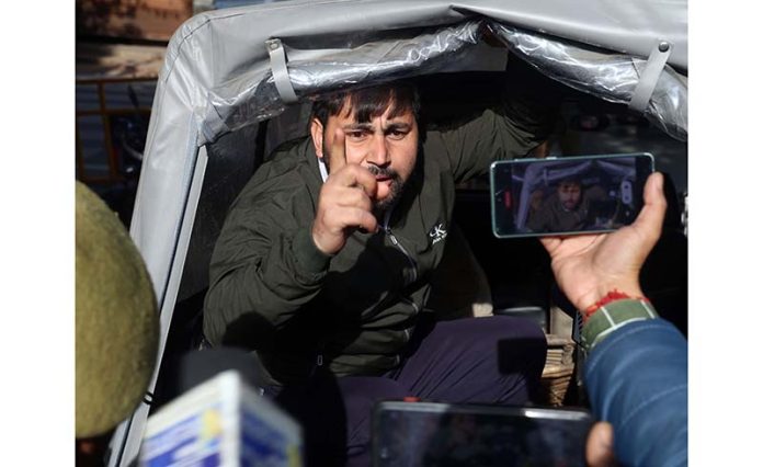 Police taking some protesting F&ES aspirants in its vehicle after foiling their march towards LG office in Jammu. -Excelsior/Rakesh