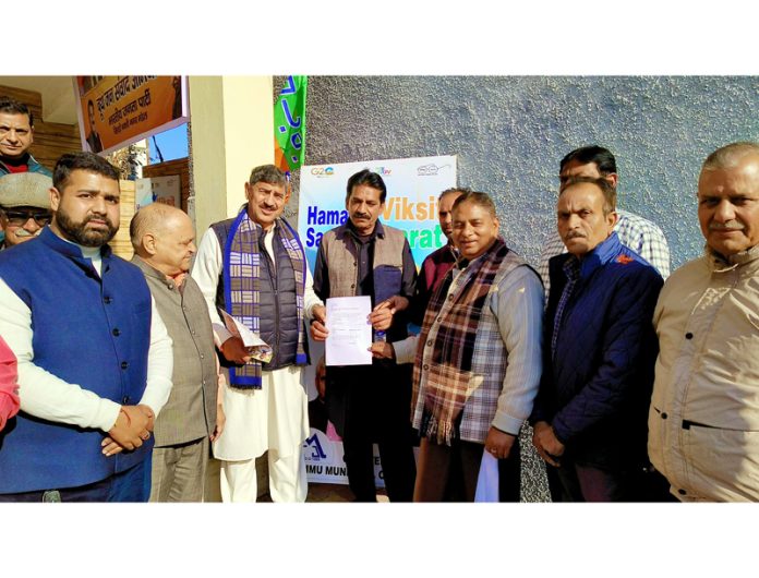 BJP MP, Jugal Kishore Sharma and ex Minister, Sat Sharma during a party function at Rajpura on Sunday.