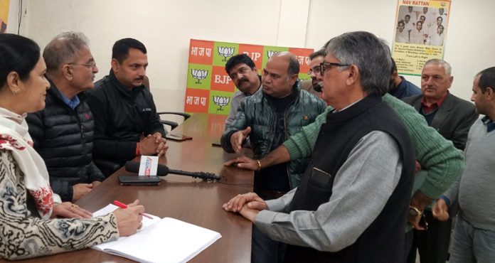 Former Dy CM, Kavinder Gupta and BJP spokesperson, R S Pathania listening public grievances at BJP office Jammu on Tuesday. Former Dy CM, Kavinder Gupta and BJP spokesperson, R S Pathania listening public grievances at BJP office Jammu on Tuesday.