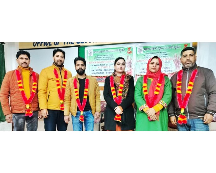 Members of newly elected block body of NHM employees for Bhaderwah posing for a group photograph. -Excelsior/Tilak Raj