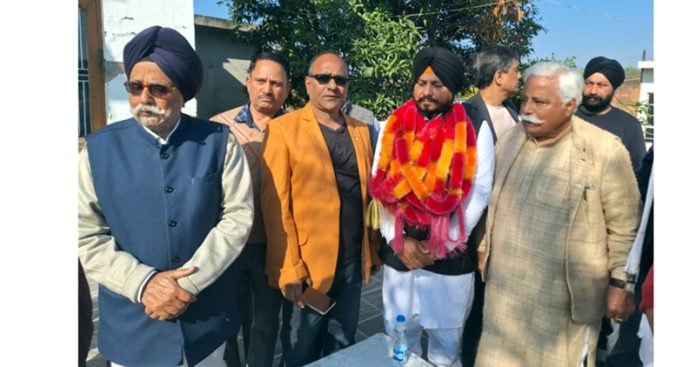 Additional general secretary NC and former Minister Ajay Sadhotra with new entrants at Lachipura in Kathua on Tuesday.