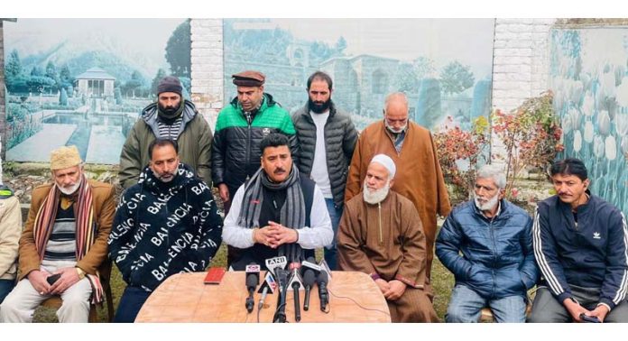 AJKPC president Anil Sharma addressing press conference in Srinagar on Friday.