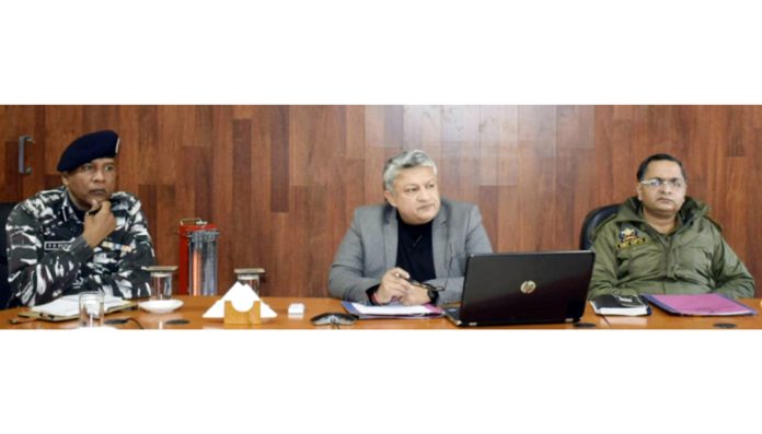 District Magistrate Vishesh Mahajan chairing a meeting on Tuesday.