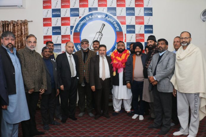 Apni Party leaders Altaf Bukhari and others with new entrants during a function in Jammu. Apni Party leaders Altaf Bukhari and others with new entrants during a function in Jammu.