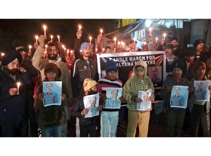 Family members and relatives of Army Alpha Gate firing victims taking out candle-march at Rajouri on Sunday. -Excelsior/Imran