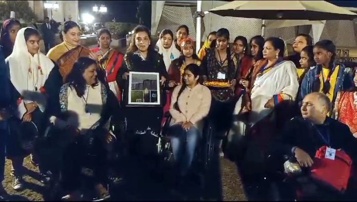 Ritu Singh and other guests along with persons with disabilities during a function at Hari Niwas, Jammu.