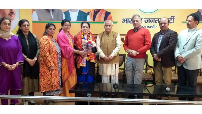 BJP leaders taking Rashmi Wazir daughter of former party president, Daya Krishan Kotwal into party fold at Jammu on Friday. BJP leaders taking Rashmi Wazir daughter of former party president, Daya Krishan Kotwal into party fold at Jammu on Friday.