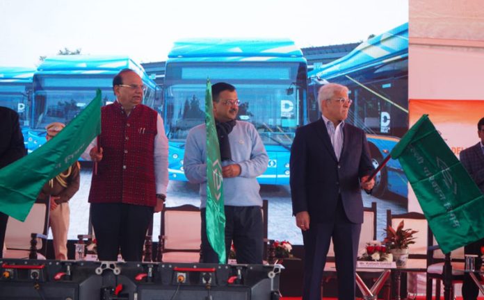 Delhi LG Vinai Kumar Saxena, Delhi Chief Minister Arvind Kejriwal and Delhi Transport Minister Kailash Gahlot flagging off new electric buses on Delhi's road at I P Depot, in New Delhi on Thursday. (UNI)