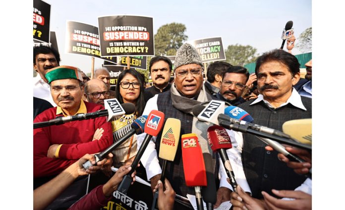 Congress President Mallikarjun Kharge with MPs of Opposition parties talking to newsmen at Vijay Chowk, in New Delhi on Thursday. (UNI)