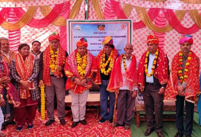 Members of J&K IWMP team including members of Jammu Chapter of INTACH posing for a group photograph at Nagrota on Wednesday.