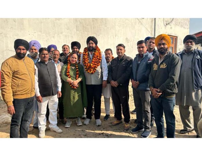BJP leader, Sarbjit Singh Johal along with others posing for a group photograph after inaugurating road blacktopping work in Ramgarh area of Samba district. BJP leader, Sarbjit Singh Johal along with others posing for a group photograph after inaugurating road blacktopping work in Ramgarh area of Samba district.