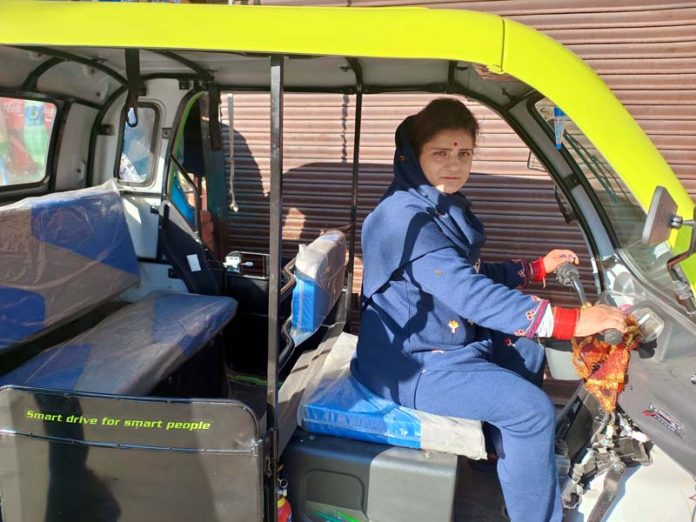 Meenakshi drives her e-rickshaw in Doda area. -Excelsior/Tilak Raj Meenakshi drives her e-rickshaw in Doda area. -Excelsior/Tilak Raj