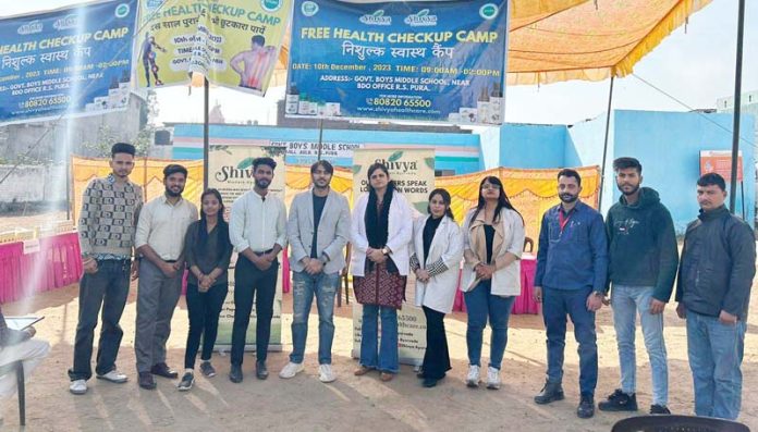 A team of doctors and paramedics posing together during a health checkup camp at RS Pura, Jammu. A team of doctors and paramedics posing together during a health checkup camp at RS Pura, Jammu.