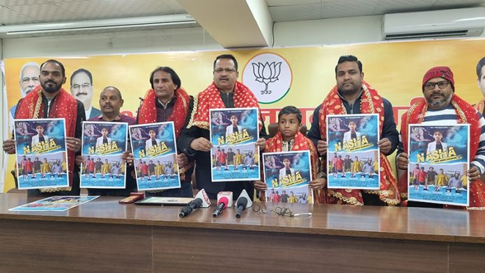 Rakesh Mahajan, in charge BJP All Cells along with Sahil Mahajan, co convenor, BJP Sanskrit Cell releasing a Dogri song at Jammu on Thursday.