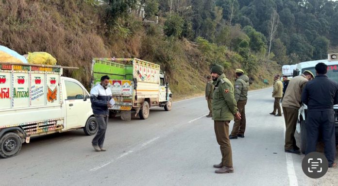 Rajouri Police in action against violators of traffic rules during a naka in Manjakote on Saturday. Rajouri Police in action against violators of traffic rules during a naka in Manjakote on Saturday.