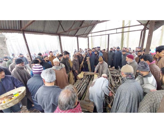 Local Muslims take part in the last rites of a Kashmiri Pandit. Local Muslims take part in the last rites of a Kashmiri Pandit.
