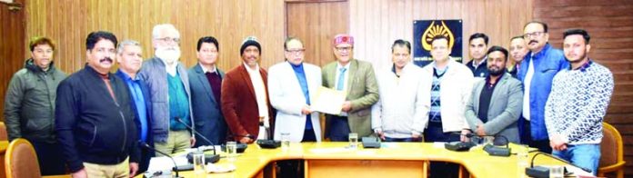 SMVDU VC displaying copy of MoU after its signing.