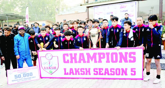 Winning team of LAKSH Season-5 posing with trophy on Sunday at Parade Ground Jammu.