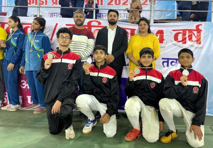 Jammu and Kashmir Fencing Sabre team (U-14) and officials posing for group photograph.