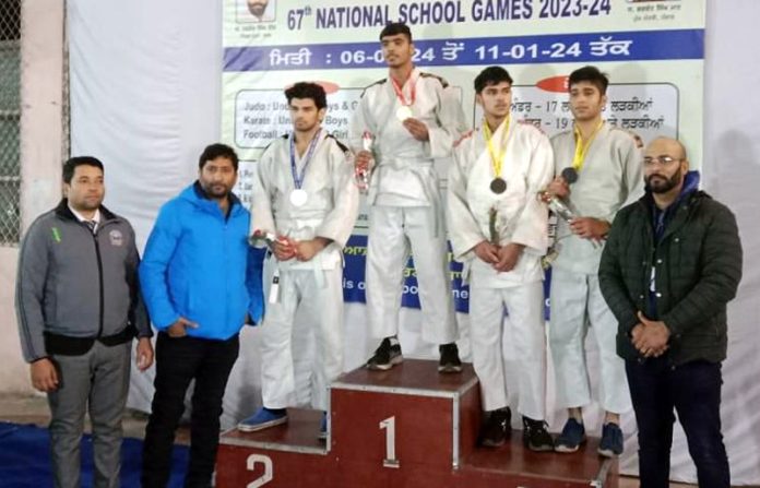 Vipul Sharma, a Judo athlete of J&K receiving medal at 67th National School Games held in Ludhiana on Tuesday. Vipul Sharma, a Judo athlete of J&K receiving medal at 67th National School Games held in Ludhiana on Tuesday.